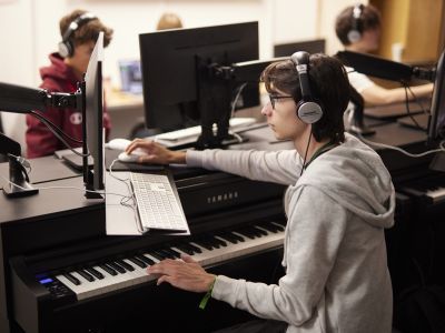 participant sitting at computer in classroom